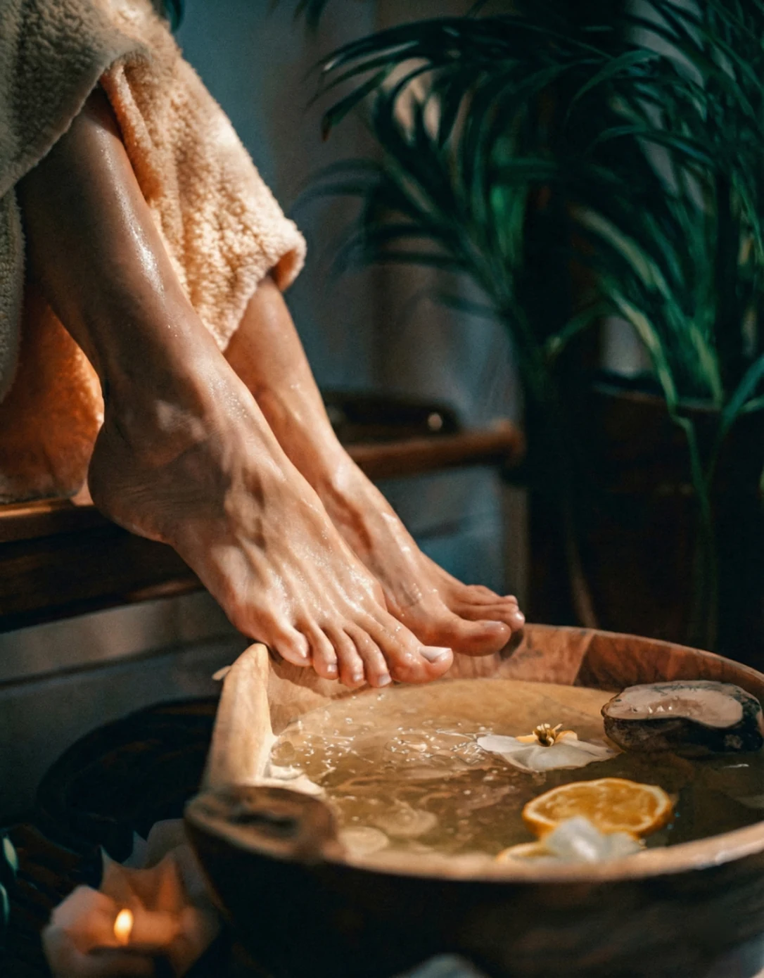 Guest enjoying a private botanical foot soak ritual at Loft Thai Spa Bangkok