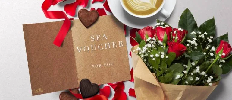 Printed spa voucher presented with flowers, ribbon and a small celebration gift