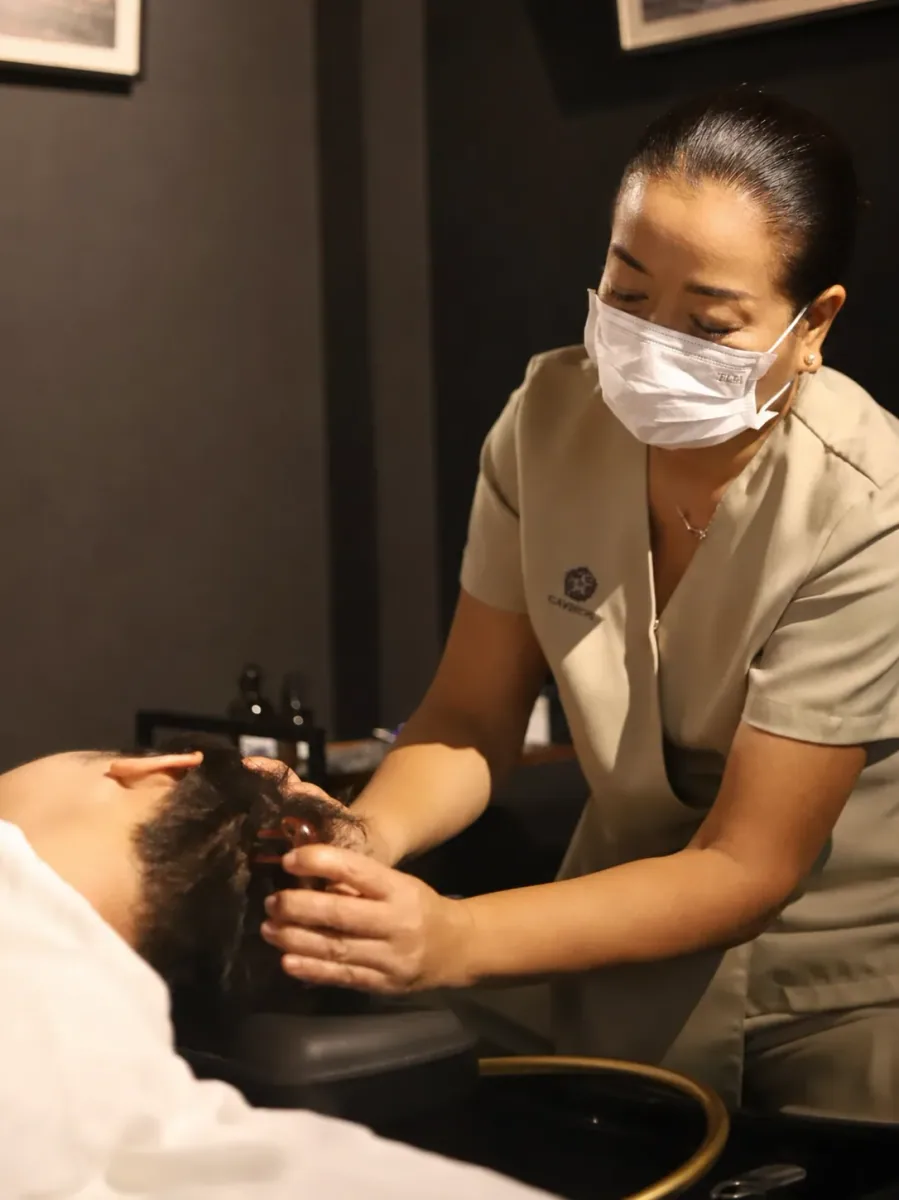 Detailed head-spa ritual delivered by the wellness team