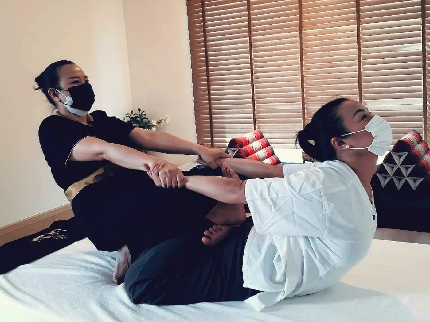 Students practising during a private massage course in Bangkok